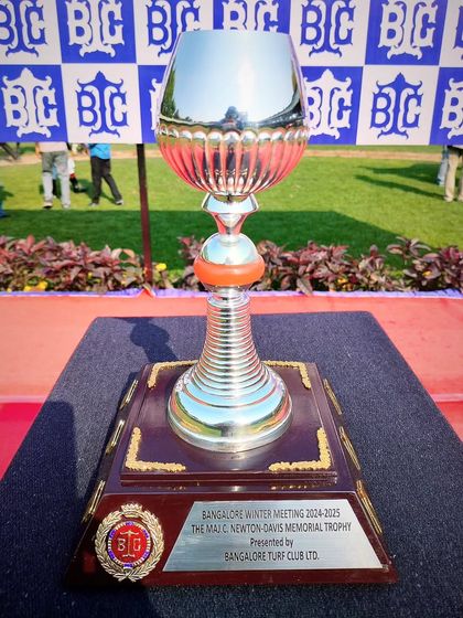 The Maj. C. Newton-Davis Memorial Trophy, a uniquely shaped silver cup.