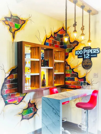 For this home mini-bar, I used a hand-painted broken brick effect to create a rustic and stylish look. The 3D illusion of colorful bricks showing through the plaster adds texture and character, making this small corner a standout feature of the home.