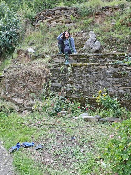 Sitting on an old stone wall in the orchard. This is my happy place, where I feel most connected to my roots.
