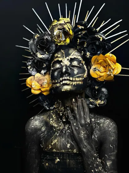 A different angle of the dark fantasy makeup, showing the texture and detail of the gold leaf application.