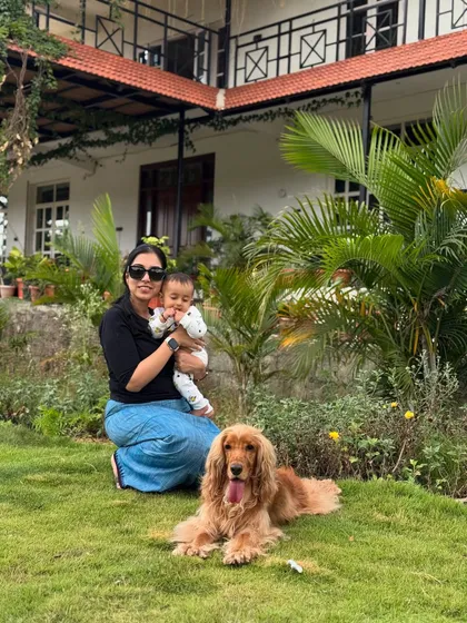A perfect family picture in the lush green garden of our staycation home.