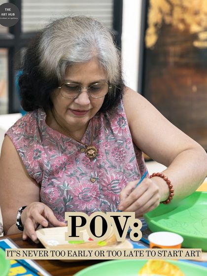 Art is a timeless hobby, and it's never too late to start. This student is enjoying a relaxing painting session, focused on creating her unique piece of art on a plate.