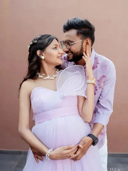 An intimate couple's portrait in our lavender gown. The one-shoulder design with a modern, structured bow is a unique and fashionable choice.