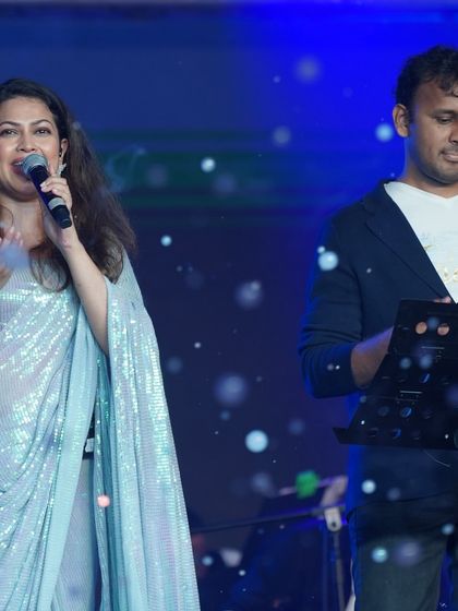 A shot of Priyanka Barve interacting with her co-performer on stage.