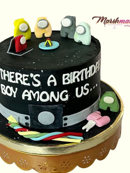 There's a birthday boy among us! This Among Us themed cake was so much fun to create. All the little crewmates and details are handcrafted from fondant, making the game come to life.