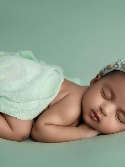 The side lying pose is a comfortable and natural position for newborns, resulting in these beautifully peaceful portraits.