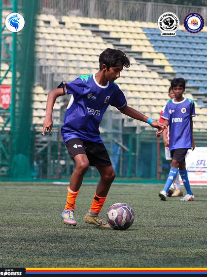 A player in full control, dribbling up the field with purpose. Our training focuses on building technically sound footballers.