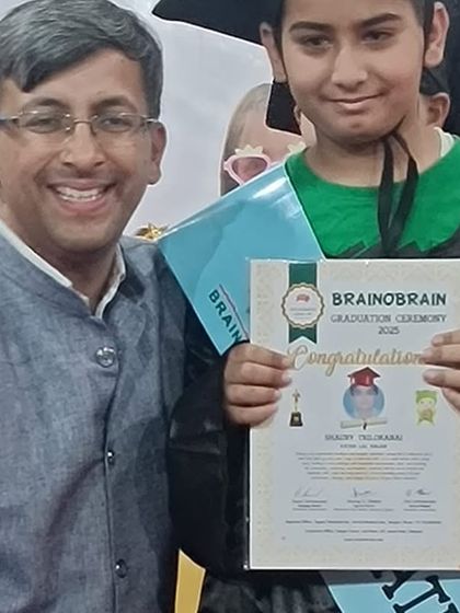 A close-up of a graduate's smiling face as he receives his certificate. The pride and confidence in their eyes are the true rewards of our program.