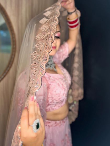 The veil shot adds a dreamy and romantic quality to this contemporary bridal look.