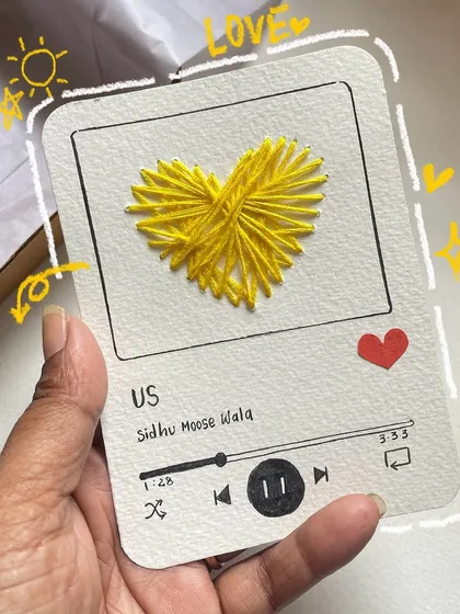 For the music lovers! A custom card designed to look like a music player, with a stitched heart and your favorite song.