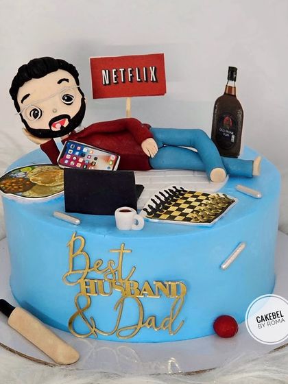 A cake for the "Best Husband & Dad" who loves to relax. This design shows him chilling with Netflix, a drink, a game of chess, and his favorite home-cooked meal.