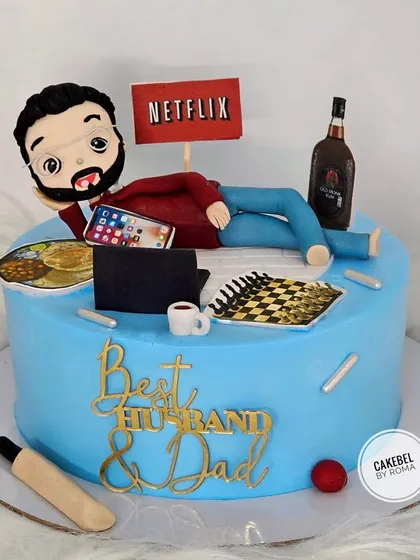 A cake for the "Best Husband & Dad" who loves to relax. This design shows him chilling with Netflix, a drink, a game of chess, and his favorite home-cooked meal.