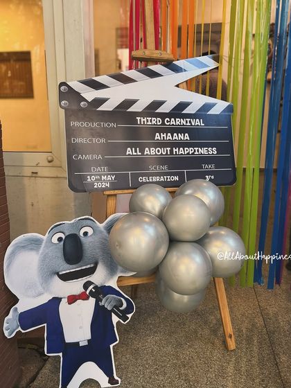 We add fun, thematic props like this custom movie clapperboard to make the event feel more immersive and provide great photo opportunities.