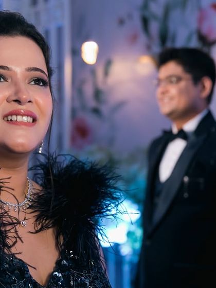 A beautiful candid of the bride, her face lit with happiness, while her groom looks on from the background. This style of storytelling adds depth to your engagement album.