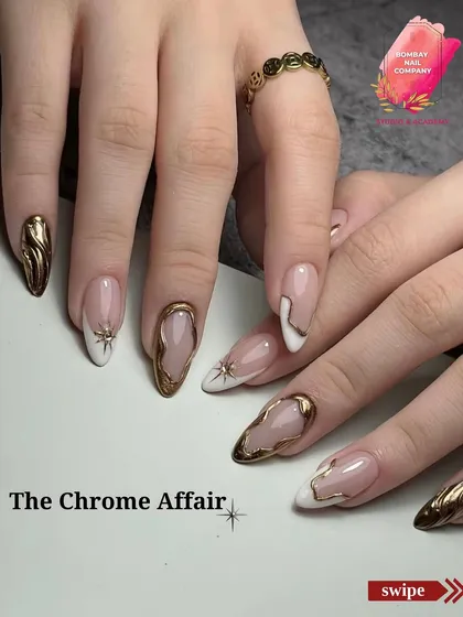 We call this one 'The Chrome Affair'. It features a mix of white tips and sculpted gold chrome on a sheer base, creating a look that is both modern and incredibly luxurious.