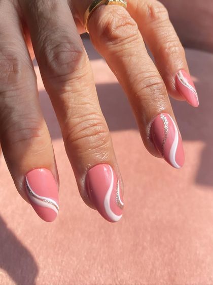 A beautiful abstract swirl design in a dusty rose pink, white, and silver glitter.