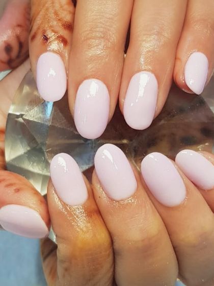 A classic baby pink manicure created with the dip powder system. This technique provides a perfectly smooth, durable finish that keeps your nails looking flawless for weeks.