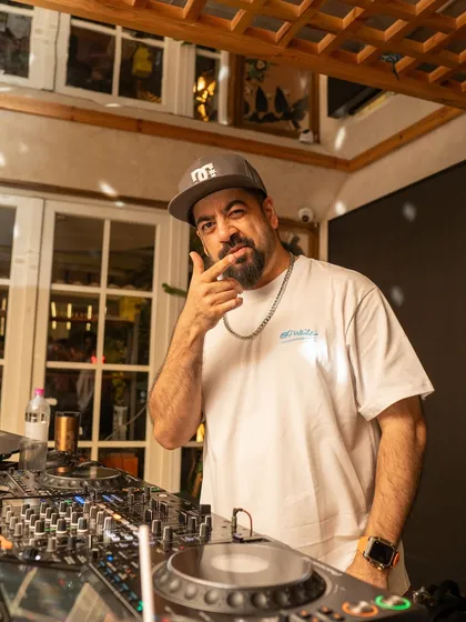 Pointing to the crowd at Monkey Bar during a Throwback Friday set. It's all about connecting with you through the classics.