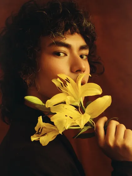 Another portrait from the 'Ophelia's Flower' series, this time with yellow lilies. The model's direct gaze and the pop of color create a confident and artistic image.