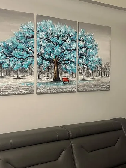 Another view of the installed triptych, showing how it complements the neutral tones of the room.