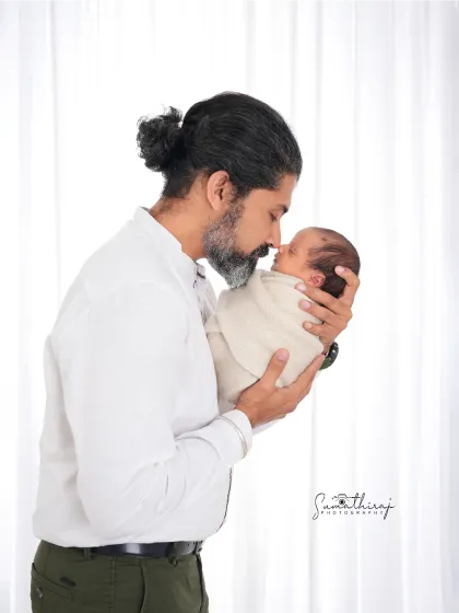 A father holding his newborn for the first time is a moment of quiet strength and tenderness. I aim to capture that powerful emotion in a simple, clean portrait that you will treasure forever.