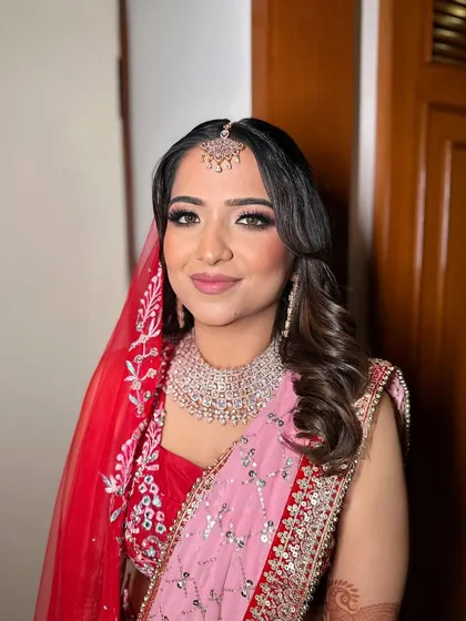 A classic bridal portrait of Prachi. The makeup is soft yet defined, ensuring she looks flawless from every angle.