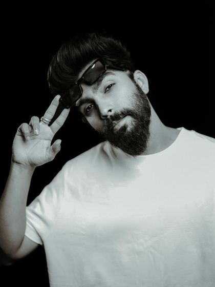 "LOOK GOOD, FEEL GOOD, DO GOOD." A professional black and white portrait that captures my personal brand and confidence.