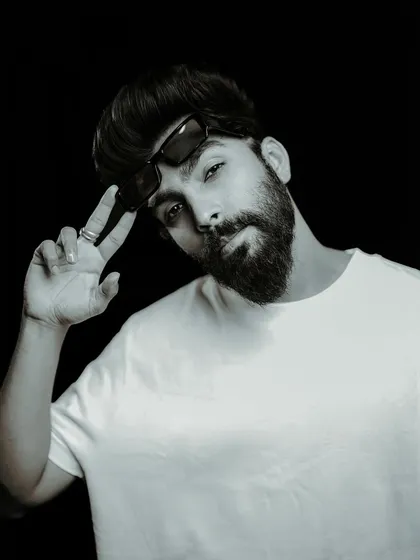 "LOOK GOOD, FEEL GOOD, DO GOOD." A professional black and white portrait that captures my personal brand and confidence.