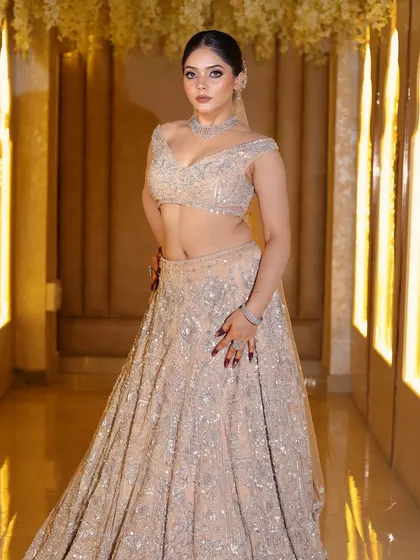Full-length shot of the modern reception bride. The makeup is designed to look flawless from head to toe.
