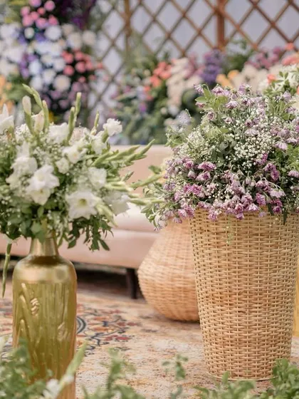 An 'Alice in Wonderland' themed Mehendi with a pastel color palette, whimsical floral arrangements, and dreamy details.