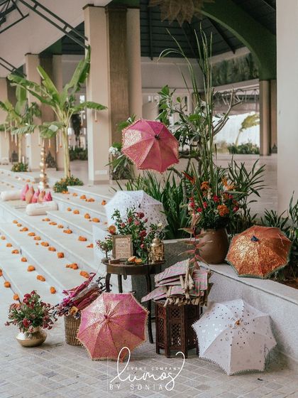 Another view of the beautiful umbrella station, adding a pop of color and functionality to the event decor.