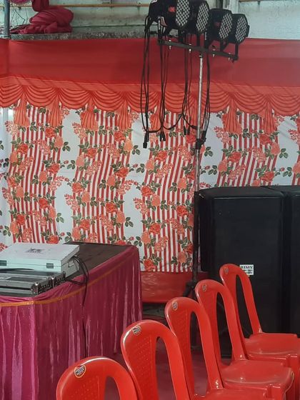 A compact DJ and lighting setup for a smaller area within a pandal. Even for smaller spaces, I use professional speakers and lights to ensure great quality.