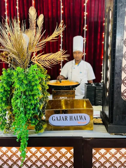 My chef at the live Gajar Halwa station, a classic Indian winter dessert, served hot.