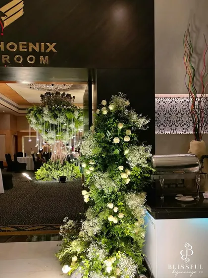 The entrance to the Phoenix Ballroom, where we installed our magnificent "Wish Tree." We love transforming indoor spaces into magical forests, creating an element of surprise and wonder for guests.