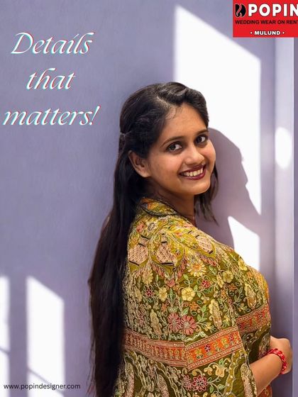 "Details that matter". This close-up shot highlights the beautiful smile of the model and the fine details of the ethnic plazo set's fabric.