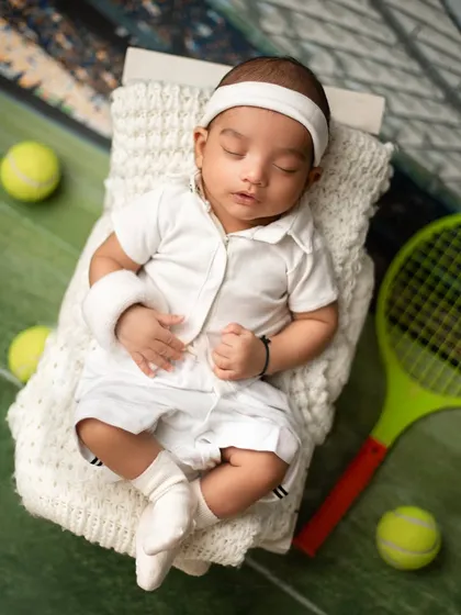 Game, set, match. For the sports-loving family, a tennis-themed newborn shoot is a fun way to celebrate your passion with your newest team member.