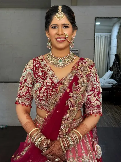 The bride ready for her big day. The neat and polished updo ensures a sophisticated and timeless look that will be cherished in photos for years to come.