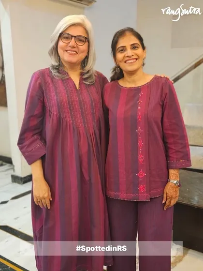 Salamrit and Meenakshi are ready for the festive season in our Haveli Collection. They are twinning in our Violet Soof Embroidered Dress and Haveli Top, showcasing the versatility of the collection.