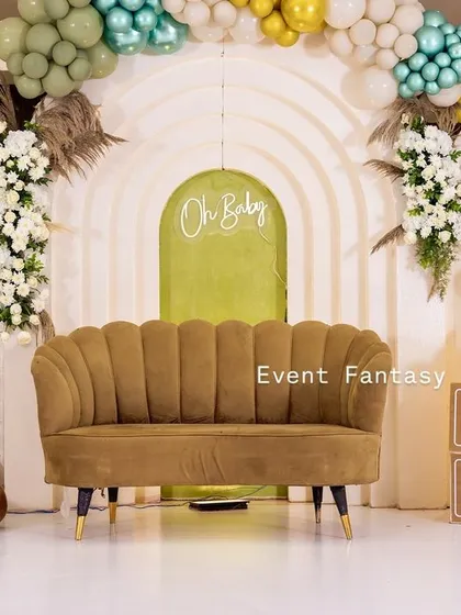 A full view of the teddy bear themed stage. The combination of a comfortable sofa for the mom-to-be, playful props like 'BABY' blocks, and a sophisticated color scheme makes this a popular choice for modern baby showers.