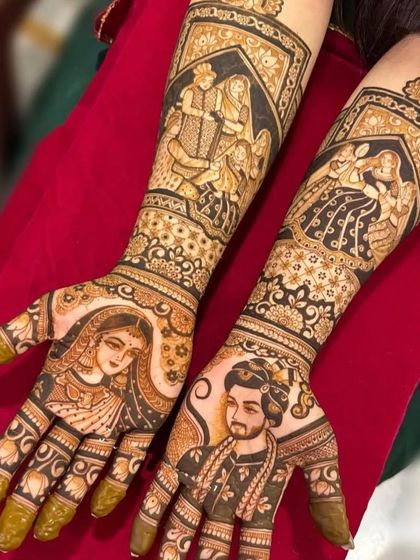 This design features a bride and groom portrait on the palms, with a scene of the pheras on the forearms.