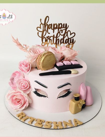 Glam, gold, and gorgeous! This makeup-themed cake is perfect for a beauty lover, featuring edible lipstick, eyeshadow palettes, and brushes, all in a chic pink and gold design.