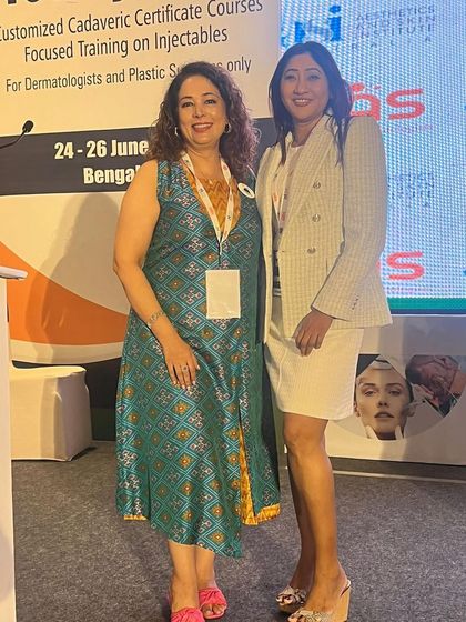 With a colleague at a DIAS conference. These events are crucial for hands-on, focused training on injectables for dermatologists and plastic surgeons.