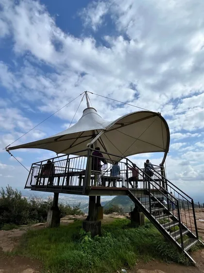 The viewpoint at Nandi Hills, a perfect spot to relax and enjoy the panoramic view of the plains below.