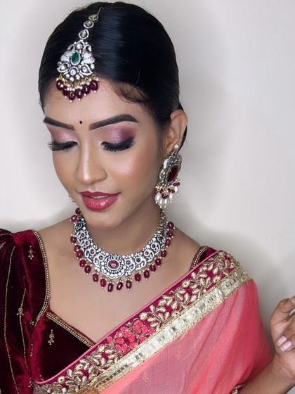 A full view of the Victorian and ruby set. It pairs beautifully with the velvet blouse and peach saree, creating a look of modern elegance.