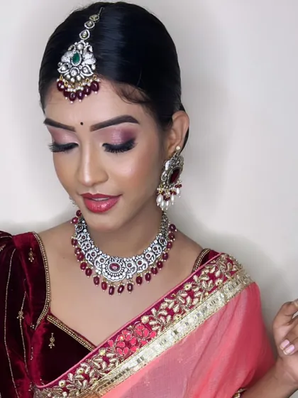 A full view of the Victorian and ruby set. It pairs beautifully with the velvet blouse and peach saree, creating a look of modern elegance.