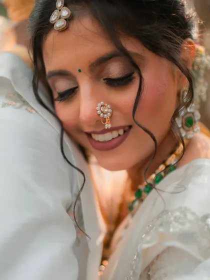 An intimate and emotional moment. For this bride's look, I used soft, earthy tones on the eyes and a warm, matte lipstick to create a gentle and romantic feel that looks beautiful both on camera and in person.