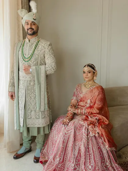A formal portrait exuding quiet confidence and grace. I styled Sakshi and Arpan in coordinated pastel and jewel-toned outfits by Ronak and Shruti, creating a look of understated royalty that feels both classic and contemporary.