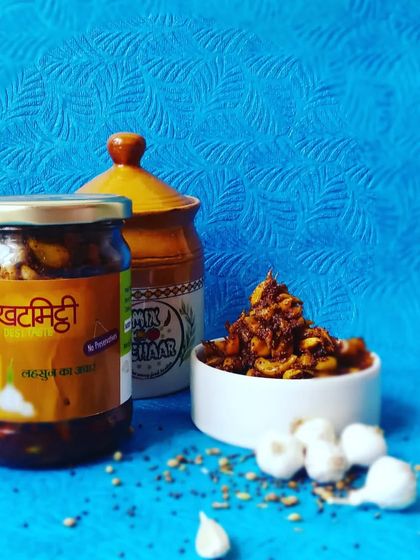 A beautifully composed shot of my garlic pickle. The fresh garlic cloves in the foreground show the quality of ingredients I use.