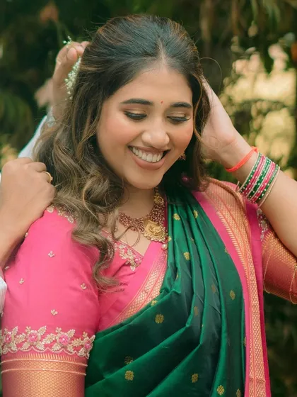 A beautiful Maharashtrian bride during her engagement ceremony. The makeup is traditional yet fresh, with soft eyes and a smile that lights up the frame.
