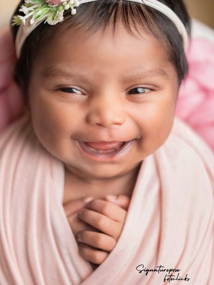 A duplicate of image 89, a rare and beautiful open-eyed newborn smile.